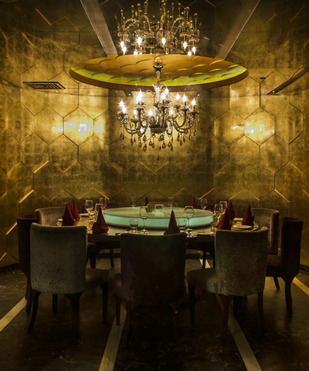 Restaurants, Bars & Lounges - Fine Dining area with luxurious chandelier on top shown - Best Architecture Consultants in Delhi NCR